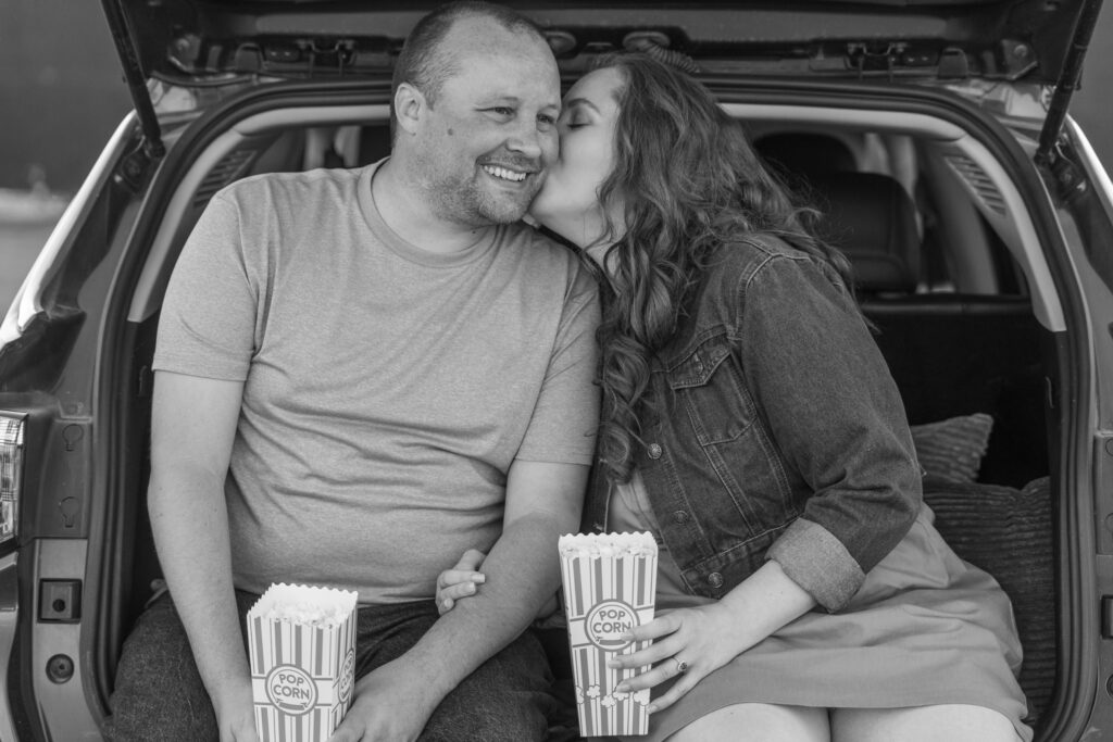 Couple eating popcorn at the south Drive-In Theatre