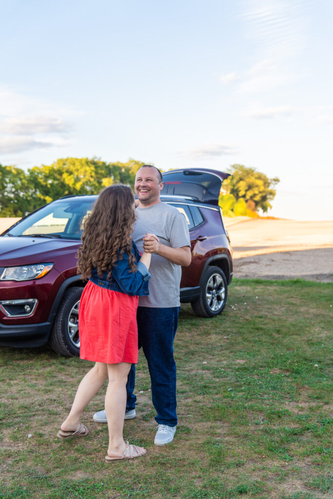 Couple slow dancing for fun at the south drive-in theatre 